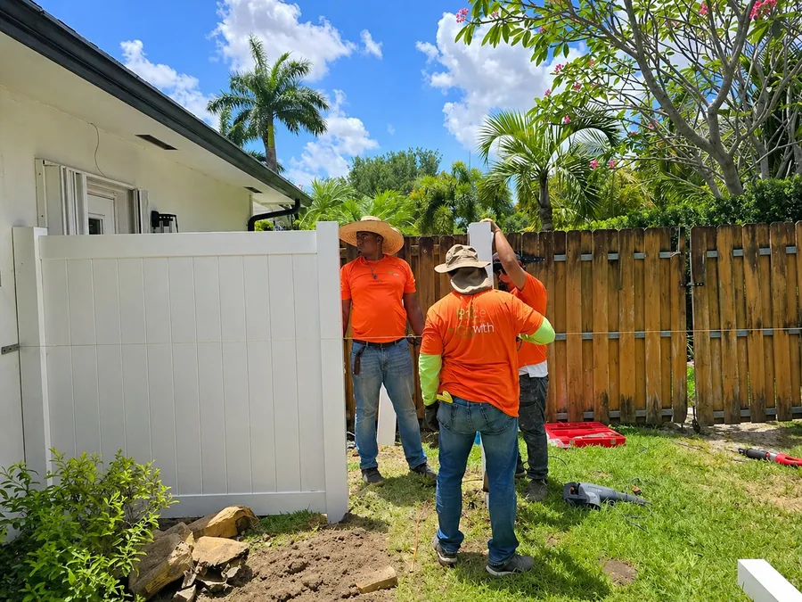 Fence with Style team installing a privacy fence in Broward County